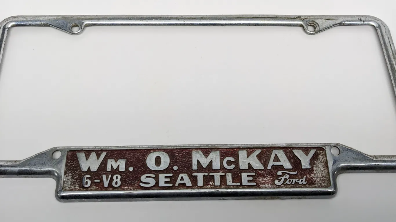 LICENSE PLATE FRAME WM O MCKAY 6-V8 FORD SEATTLE WASHINGTON WN WASH WA