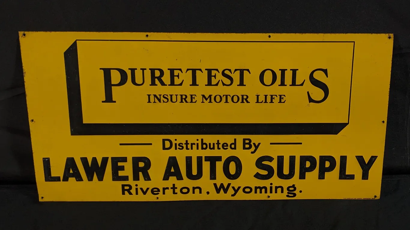 EMBOSSED TIN SIGN PURETEST OILS LAWER AUTO SUPPLY RIVERTON WYOMING