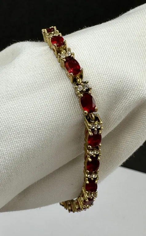 Avon Gold Tone Ruby Rhinestone Tennis Bracelet & Extender