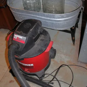 Metal Tub with Two Glass Carboys and Craftsman Shop Vac