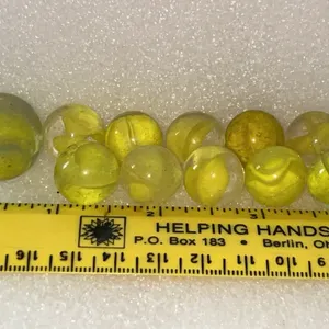 Yellow Cats Eye 10 Ct & 1 Shooter Marbles