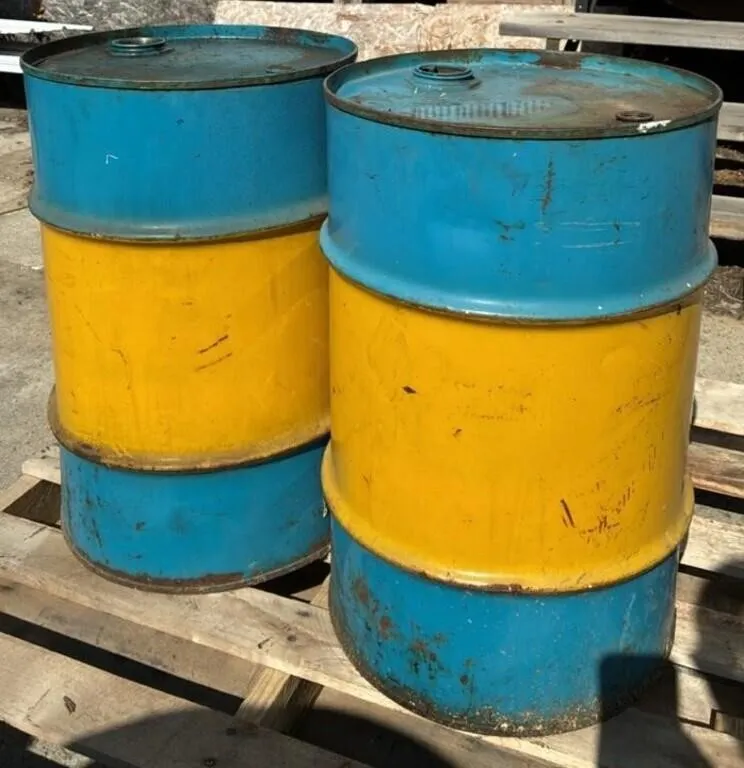 Two 25 Gal Metal Barrels.