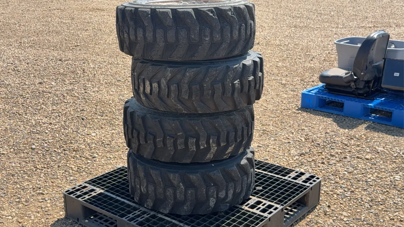 QTY of (2) 20 x 8.0-10 Bobcat tires with rims and QTY of (2) Tires 23 X 10.5 - 12