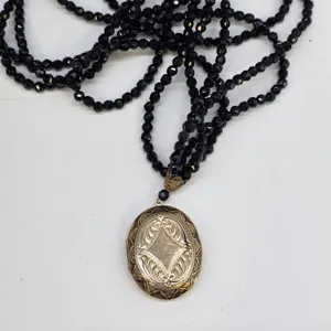 Vintage Multi Strand Black Faceted Bead Necklace Gold Tone Engraved Oval Locket