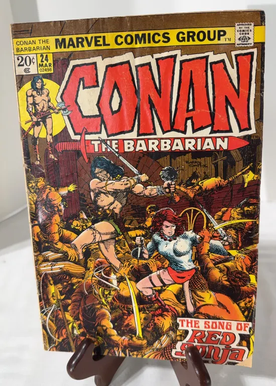 Vintage copy of Conan the Barbarian #24 w/ the first cover and first full story of Red Sonja