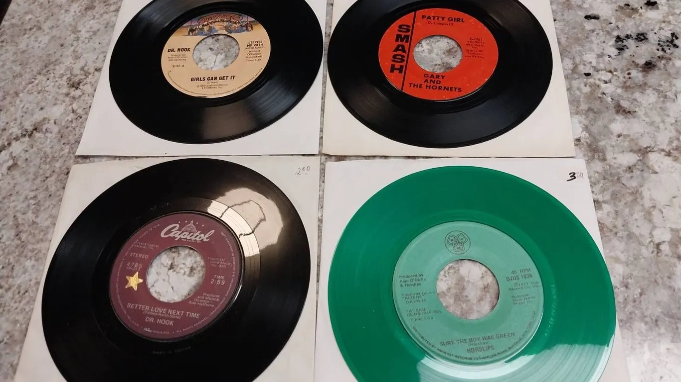 4 Assorted 7-Inch 45 RPM Records Featuring Dr. Hook, Gary and the Hornets, and Horslips, With Green