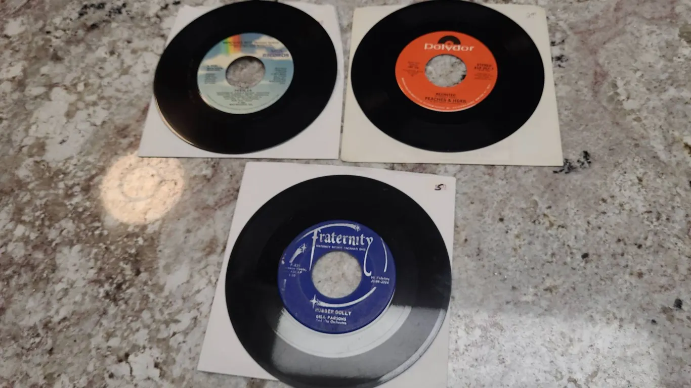 Three 7-Inch 45 RPM Singles: Pebbles “Mercedes Boy”, Peaches & Herb “Reunited”, Bill Parsons “Rubber