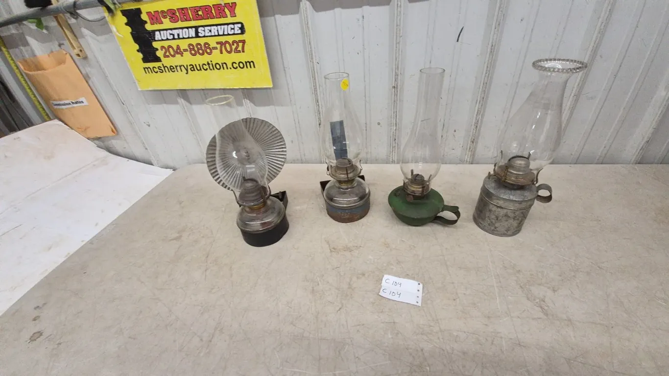 Four Oil Lamps: Wall-Mount Reflector Lamp, Wall-Mount Lamp, Green Base Lamp, and Metal Base Lamp