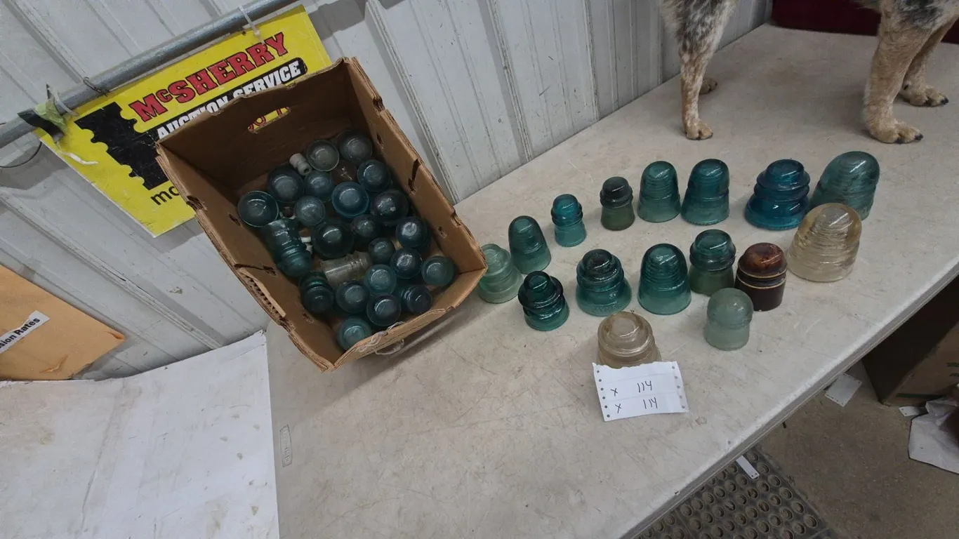 Collection of Glass and Ceramic Insulators, Including Teal, Clear, and Brown Pieces