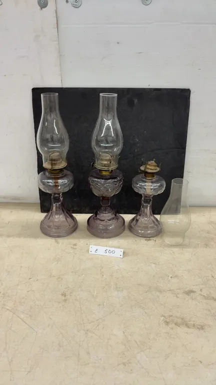 Three Antique Purple-Tinted Glass Kerosene Oil Lamps With Chimneys, Late 19th/Early 20th Century