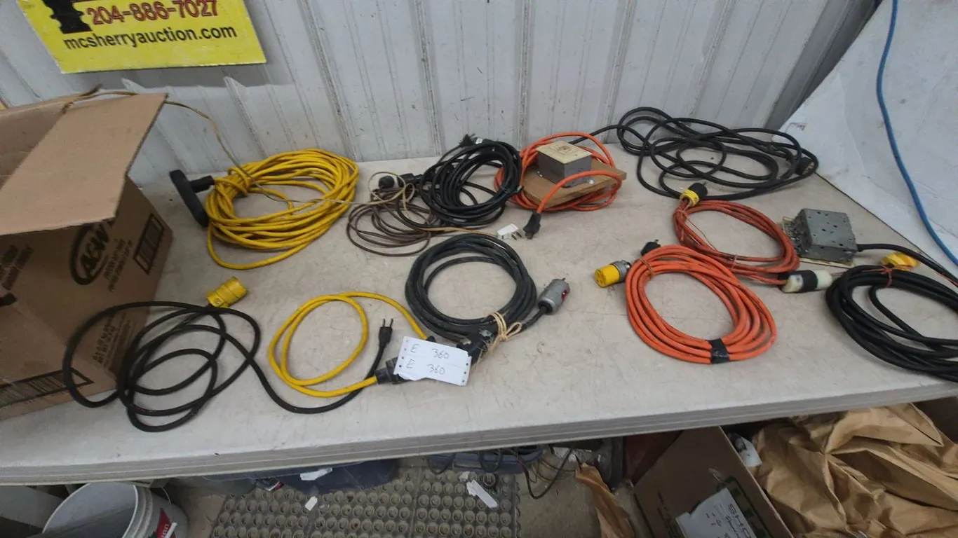Assorted Extension Cords and Power Strips, Incl. Yellow, Black, and Orange Cords