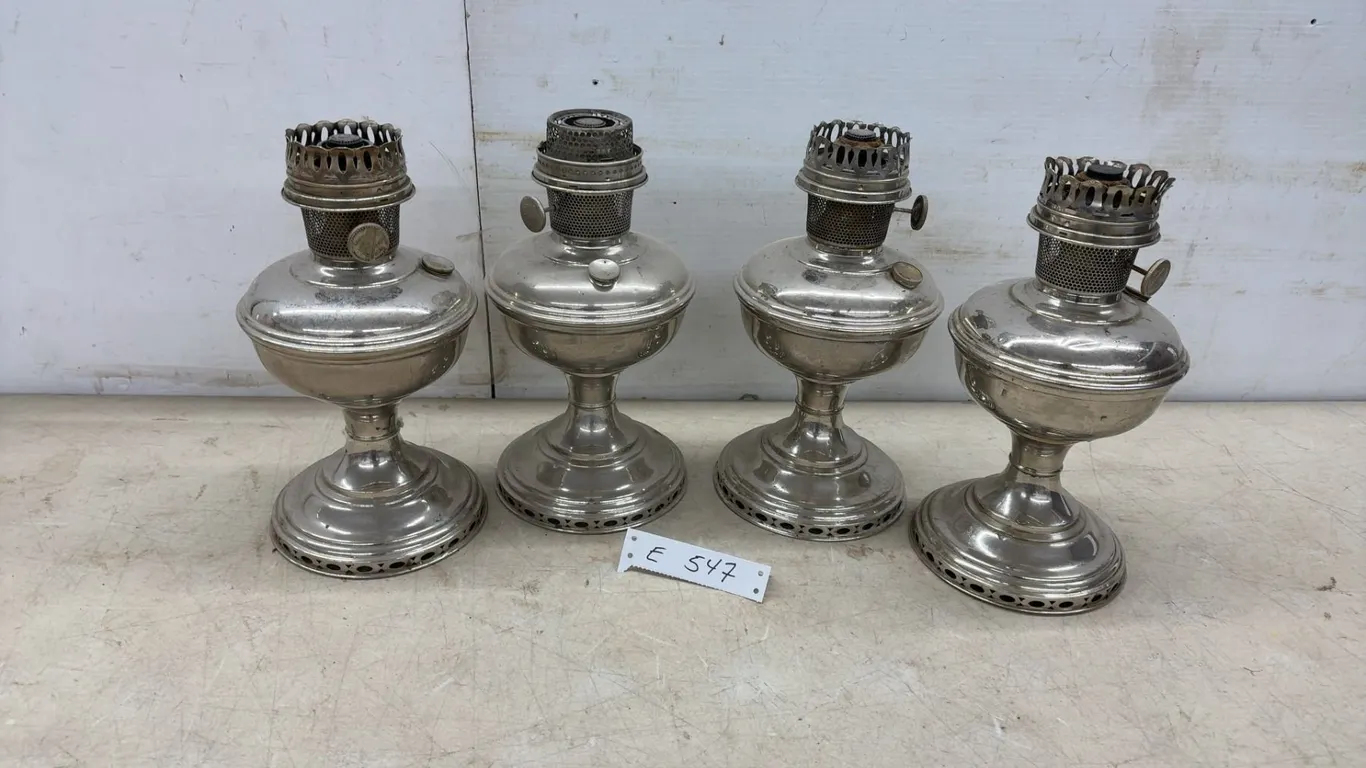 Four Antique Nickel-Plated Kerosene Aladdin Oil Lamps with Pierced Bases, No Chimneys