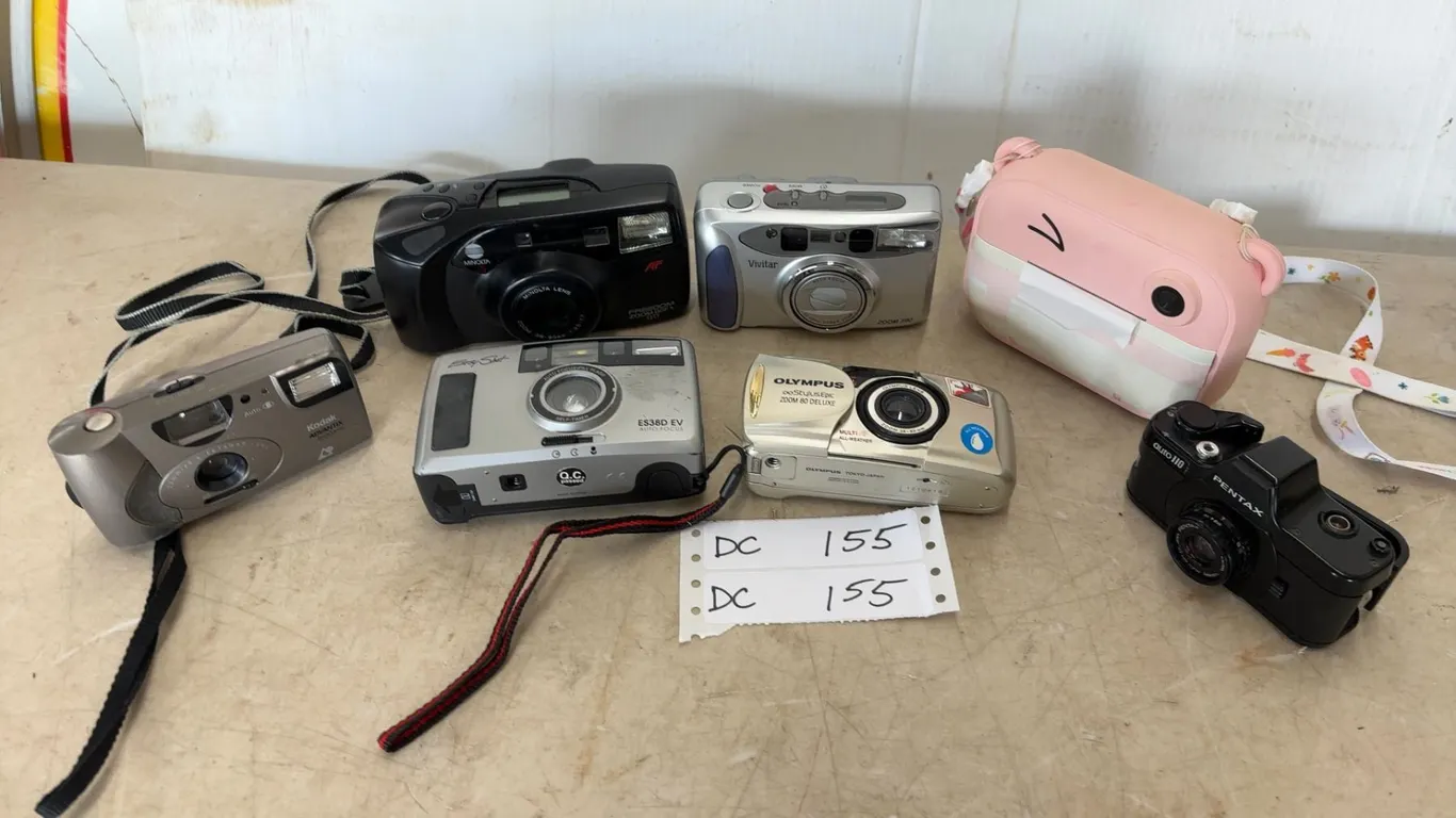 Lot of 7 Cameras: Vivitar, Kodak Advantix 1600 auto, Pentax auto 110, Easy Shot ES38D EV, Olympus S