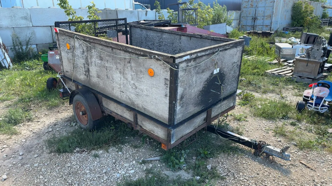 7 Ft Single Axle Utility Trailer with Wood Sides and Expanded Metal Ramp Gate