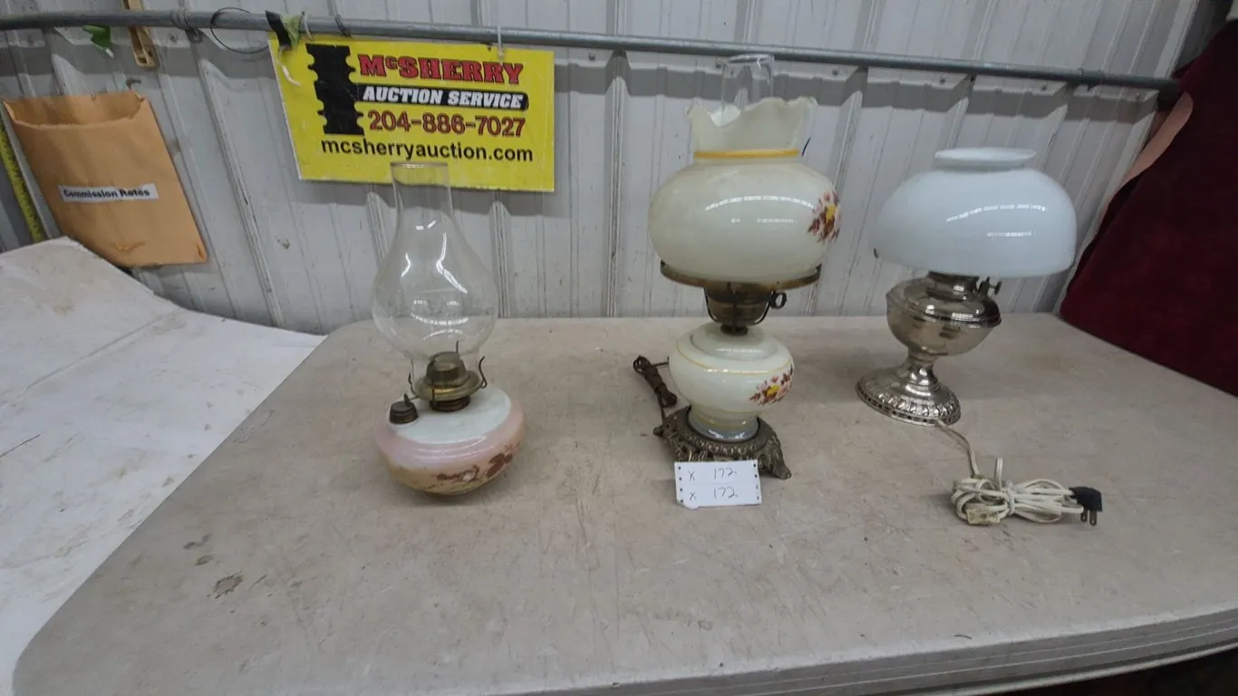 Three Oil Lamps: Clear Glass and Pink Base, Floral Painted White, and Silver Tone and White