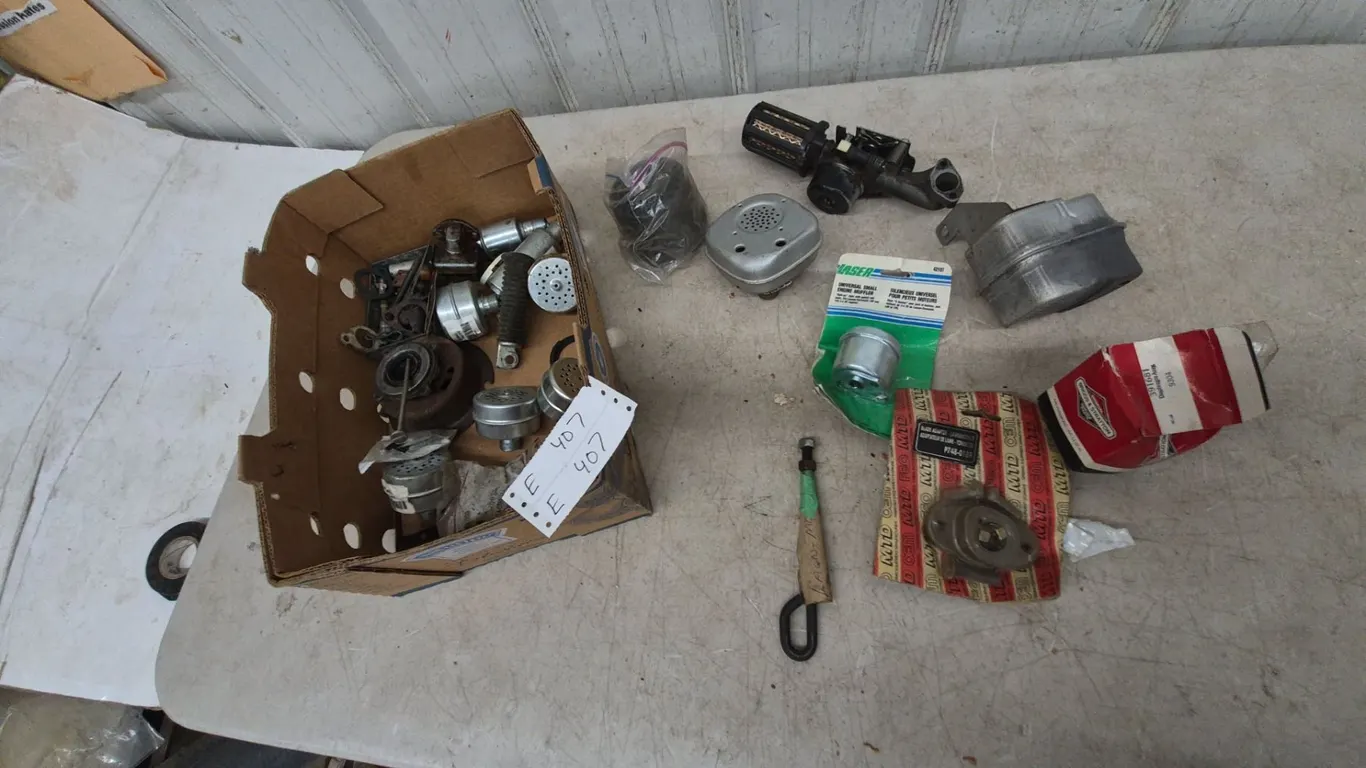Box of Briggs and Stratton and MTD Engine Parts, Mufflers, Air Filters