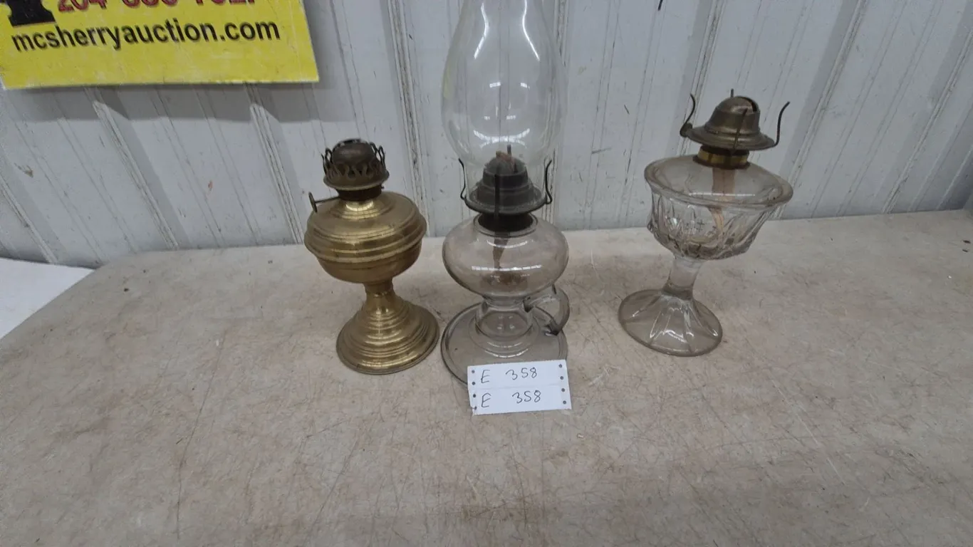 Three Oil Lamps: Brass Base Lamp, Clear Glass Lamp one with Chimney, and Clear Glass Lamp