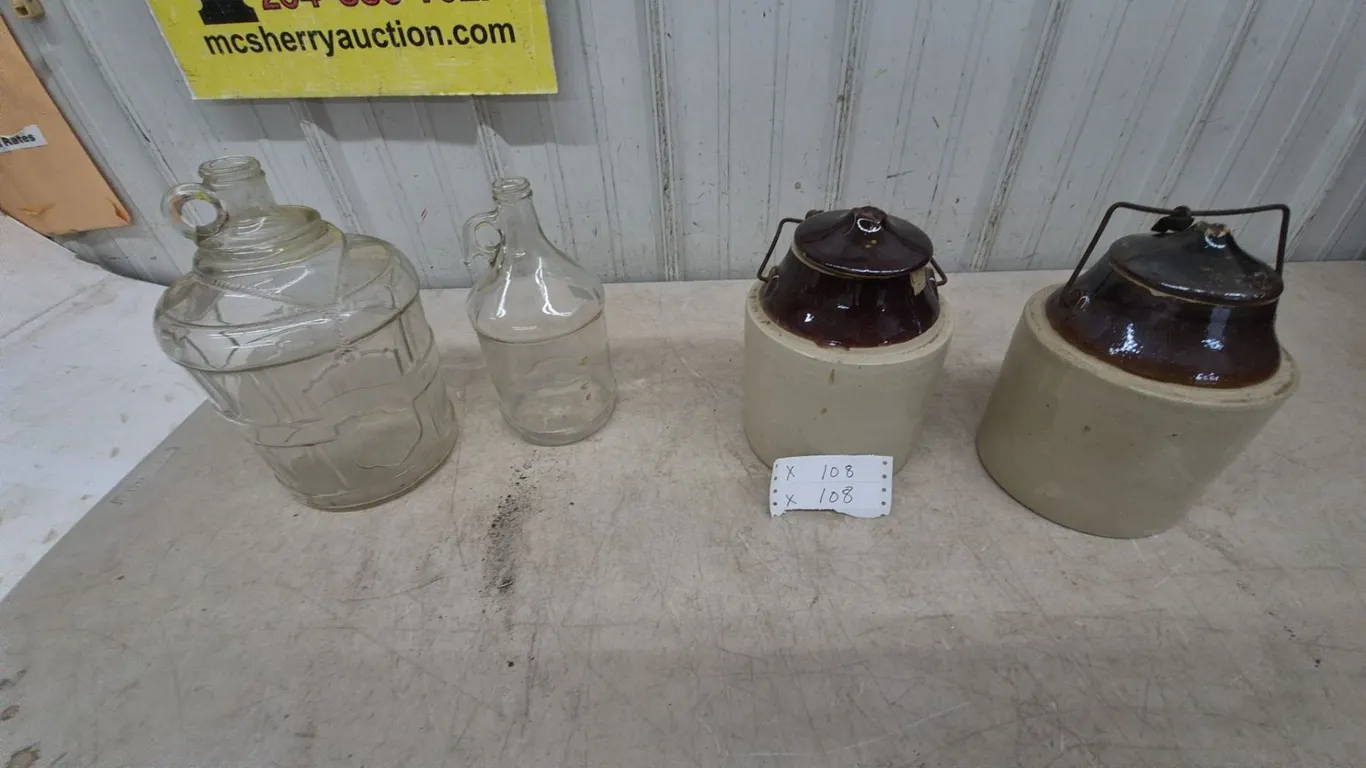 Two Glass Jugs and Two Stoneware pickle Crocks with Lids and Wire Bails