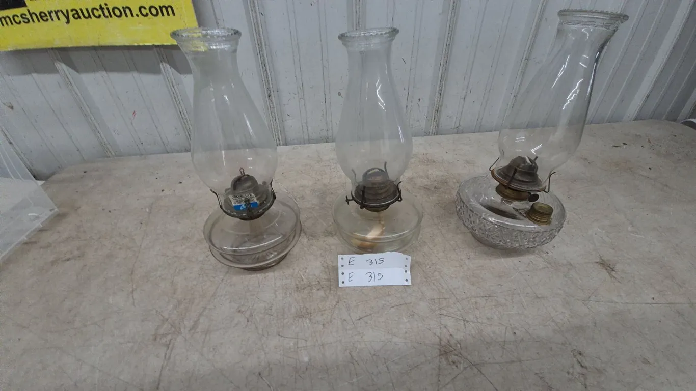 Three Oil Lamps: Two Clear Glass and One Cut Glass Base, All with Clear Glass Chimneys