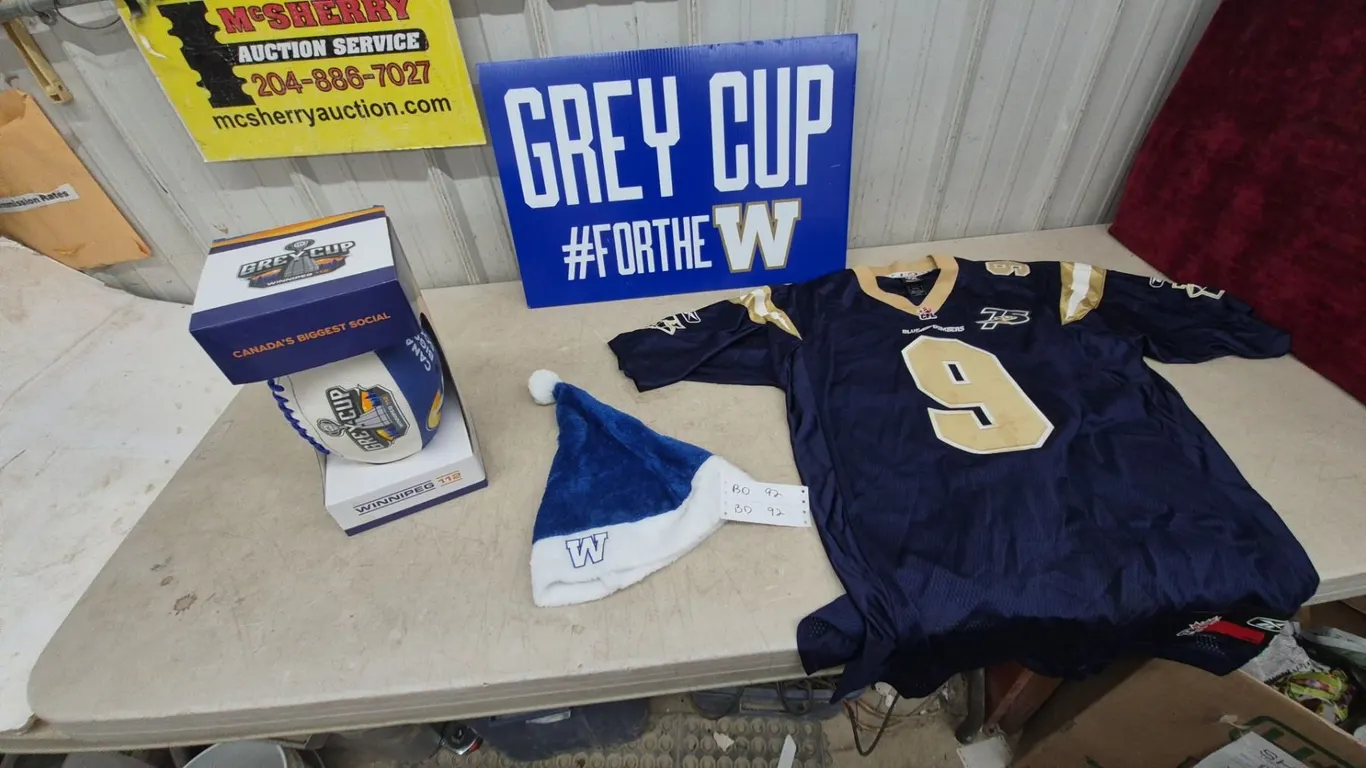 Grey Cup #FOR THE W Sign, Winnipeg Blue Bombers #9 Jersey, and Santa Hat