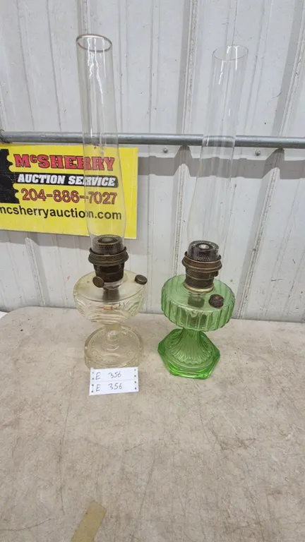 Two Aladdin Kerosene Lamps: Clear Glass and Green Glass, Both with Chimneys and Burners