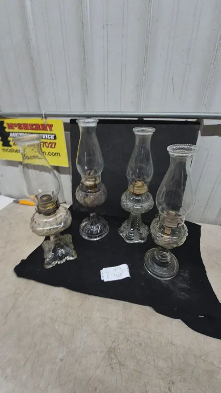 4 Clear Glass Oil Lamps with Chimneys and Brass Burners.
