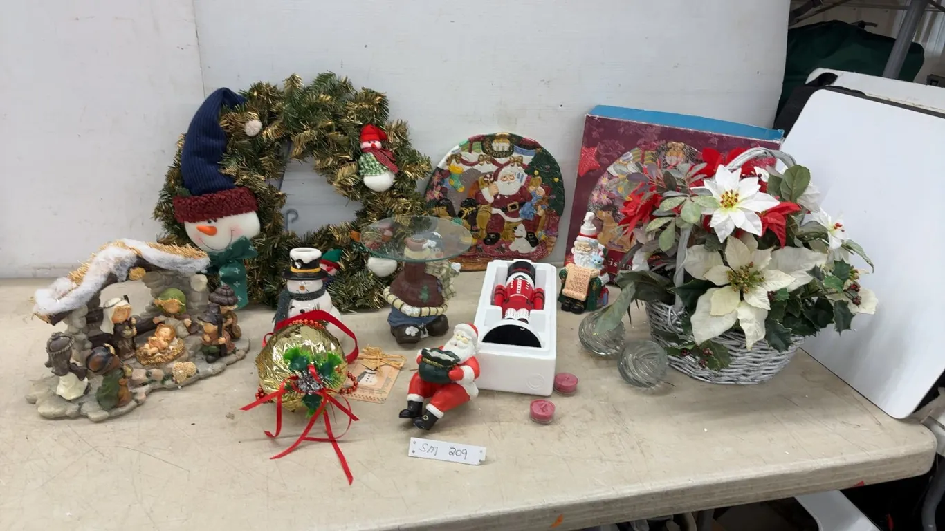 Assorted Christmas Décor Including Wreath, Nativity Scene, Nutcracker, Snowman Candle Holder