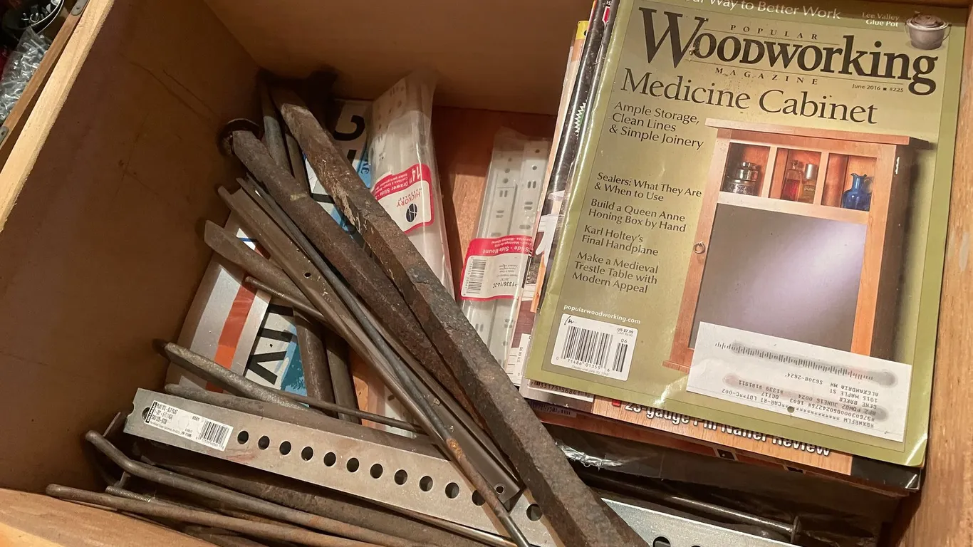 1 Large Bin of Magazines, Railroad Spikes and Pry Bars