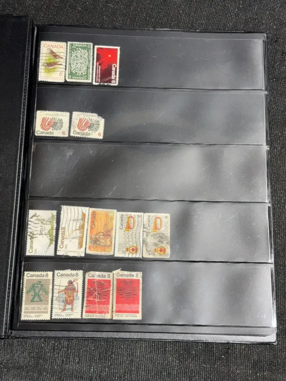 Album of 295 Canadian Postage Stamps in Black 'Uncle Paul' Binder