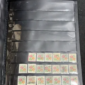 Album With 563 Used United States Commemorative and Definitive Stamps