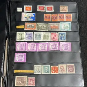 Album with 880 Assorted Worldwide Stamps in Uncle Paul Binder