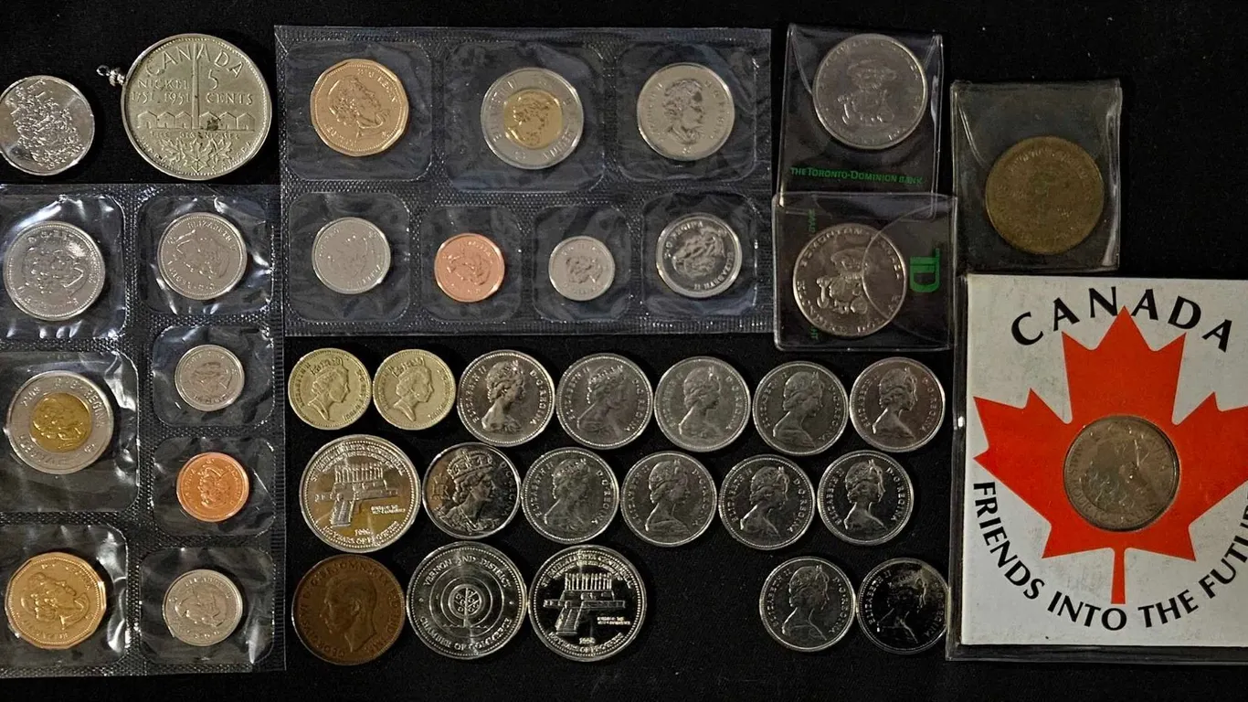 Canadian Coin Collection Including Klondike Dollars, Canadian Mint Sets, and Commemorative Tokens