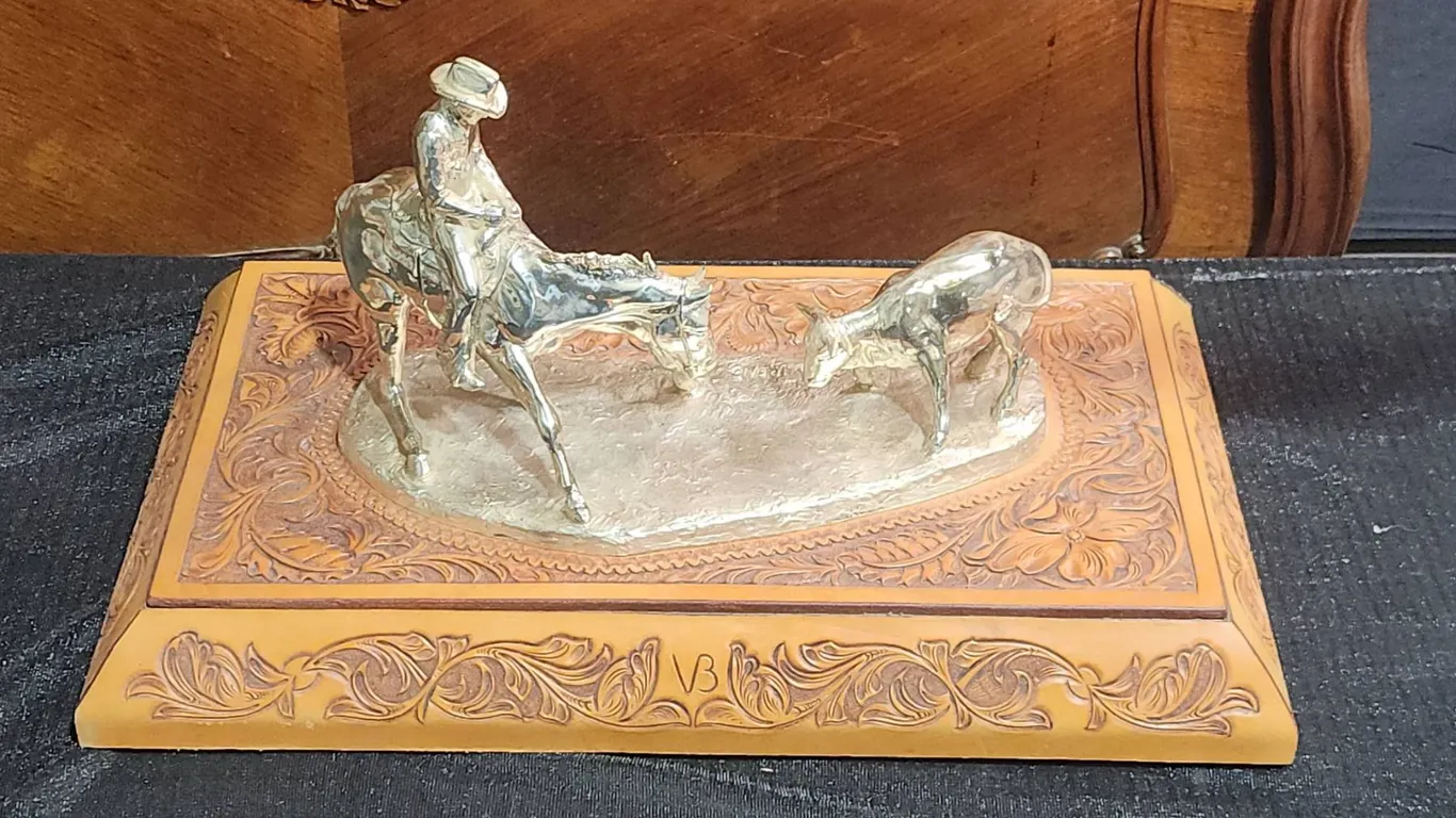 Jim Reno Western Cowboy and Calf Sculpture on Tooled Leather Base