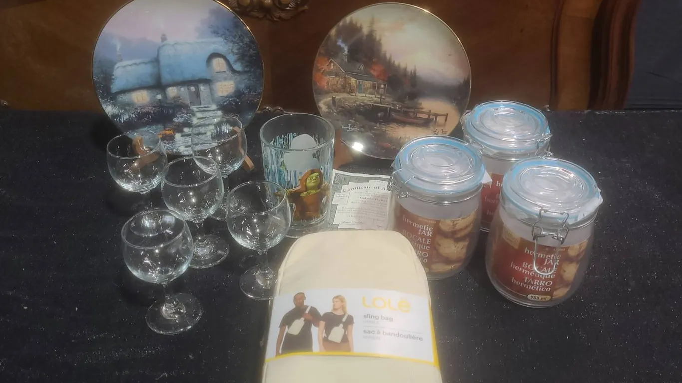 Lot: Thomas Kinkade Plates, Lolë Sling Bag, Drinkware, and Storage Jars