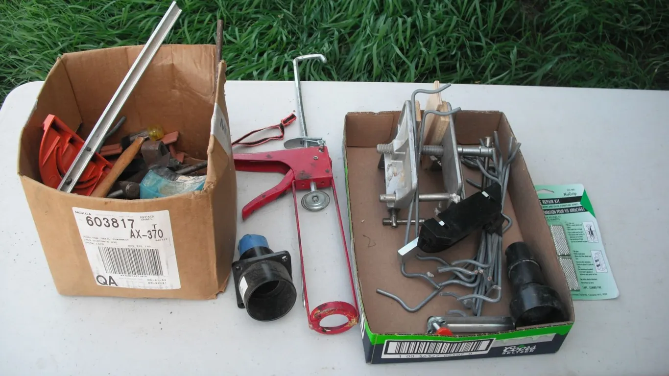 assorted tools - caulking gun, guide, etc.