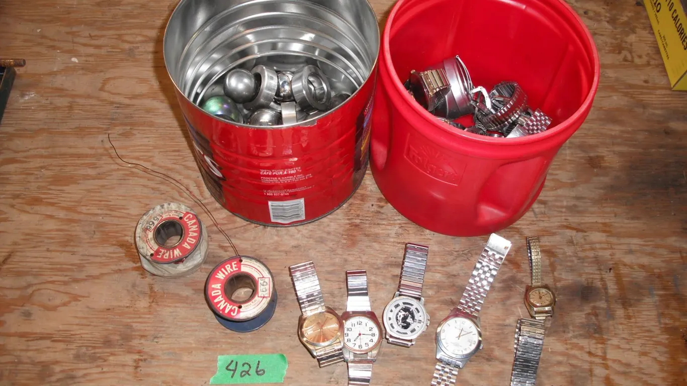 assorted watches, wire, ball bearings, etc.
