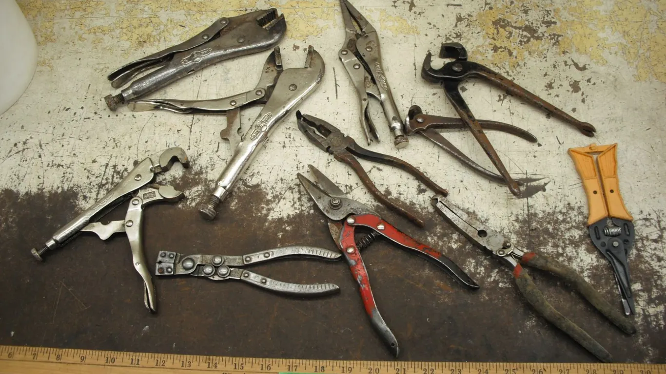 lot of vice grips, snips, pliers, etc.