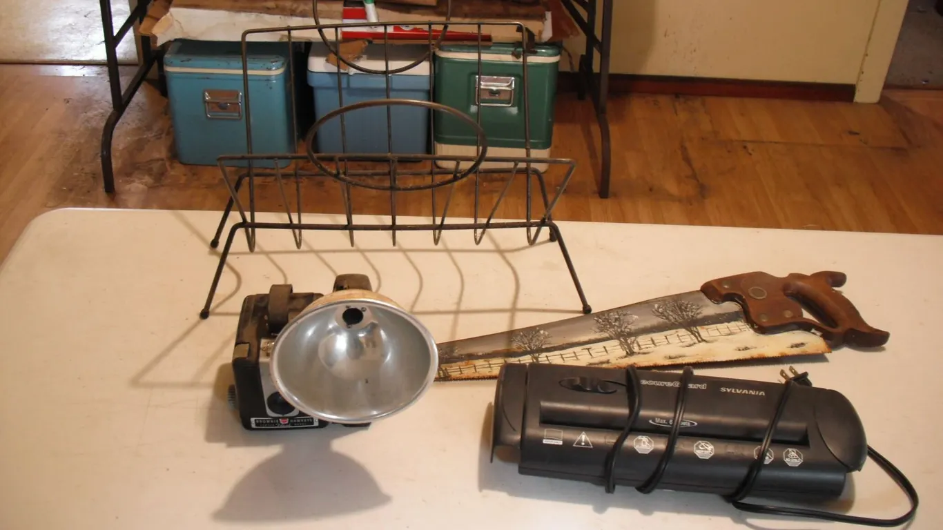 vintage camera, painted saw, etc.