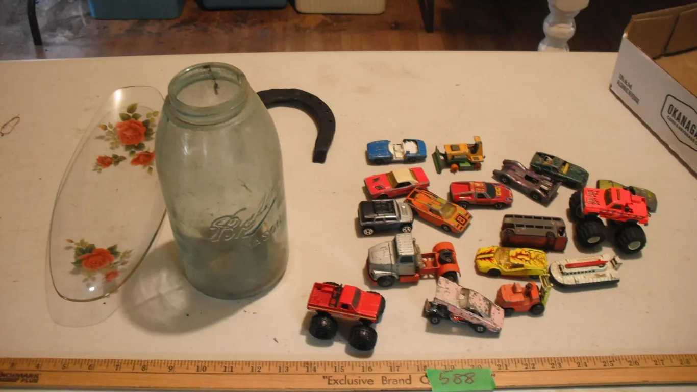 toy cars, horseshoe, tray and Ball mason jar