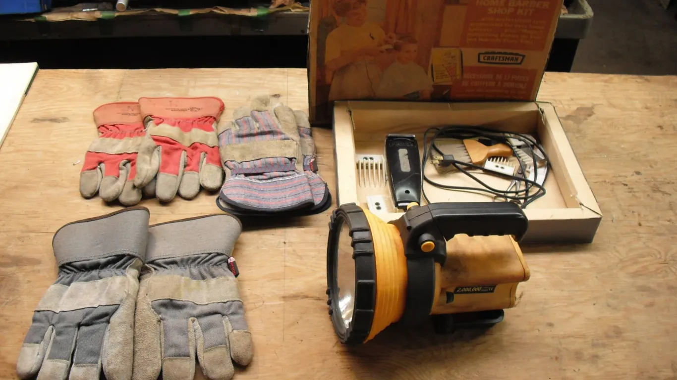 spotlight, barber kit and work gloves