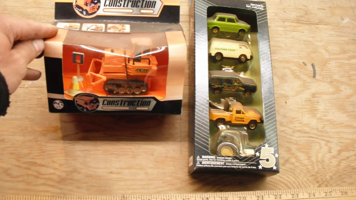 windup bulldozer and diecast cars and tractor