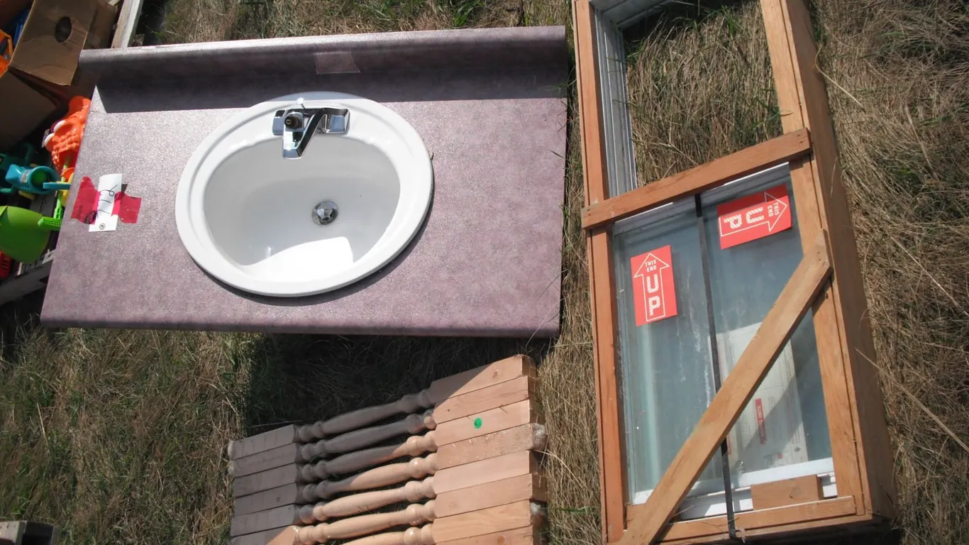 sink with counter, stair rails, sliding window