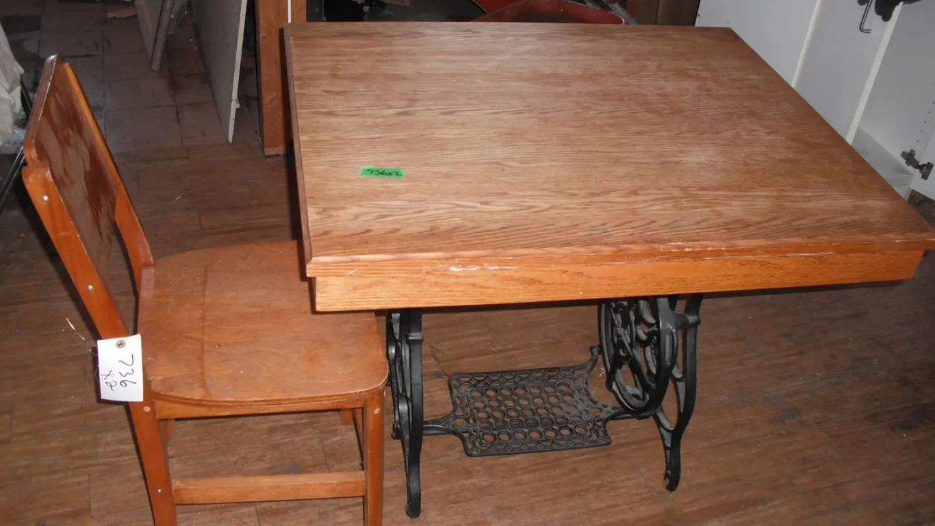 table with sewing machine cast base and chair