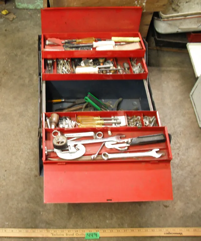 large tool box with assorted tools - wrenches, hammers, wire strippers, screws, etc.