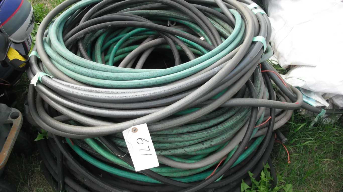 large lot of garden hoses