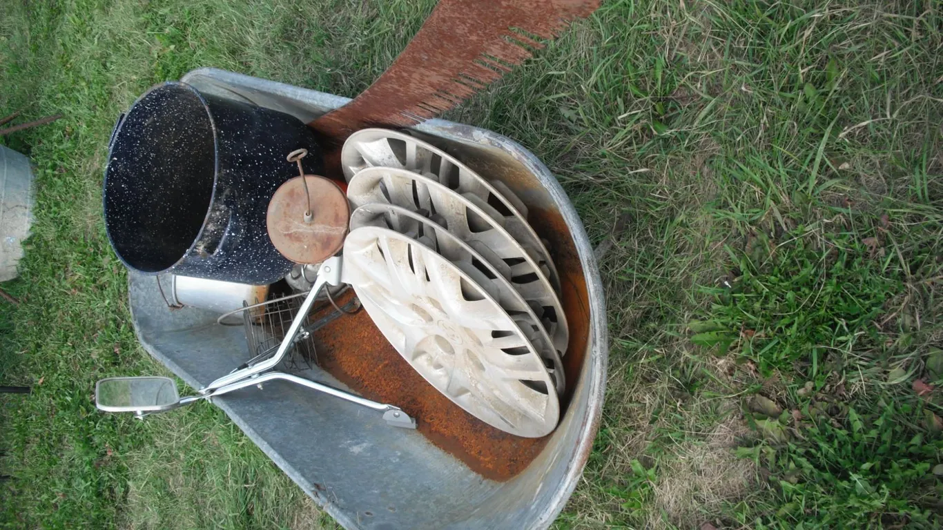 galvanized tub with crosscut saw, mirror, hedge trimmer, etc.