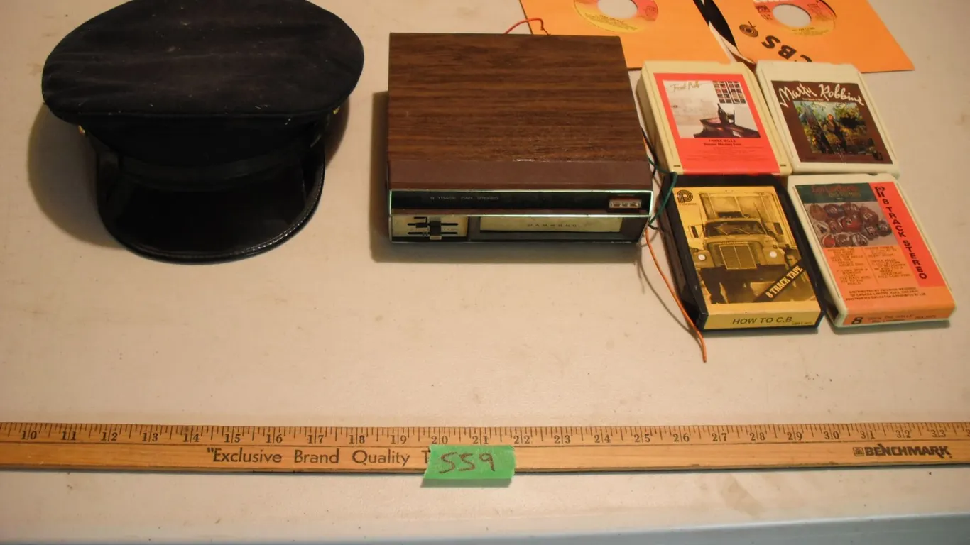 8 track, player, captains hat and 2 records