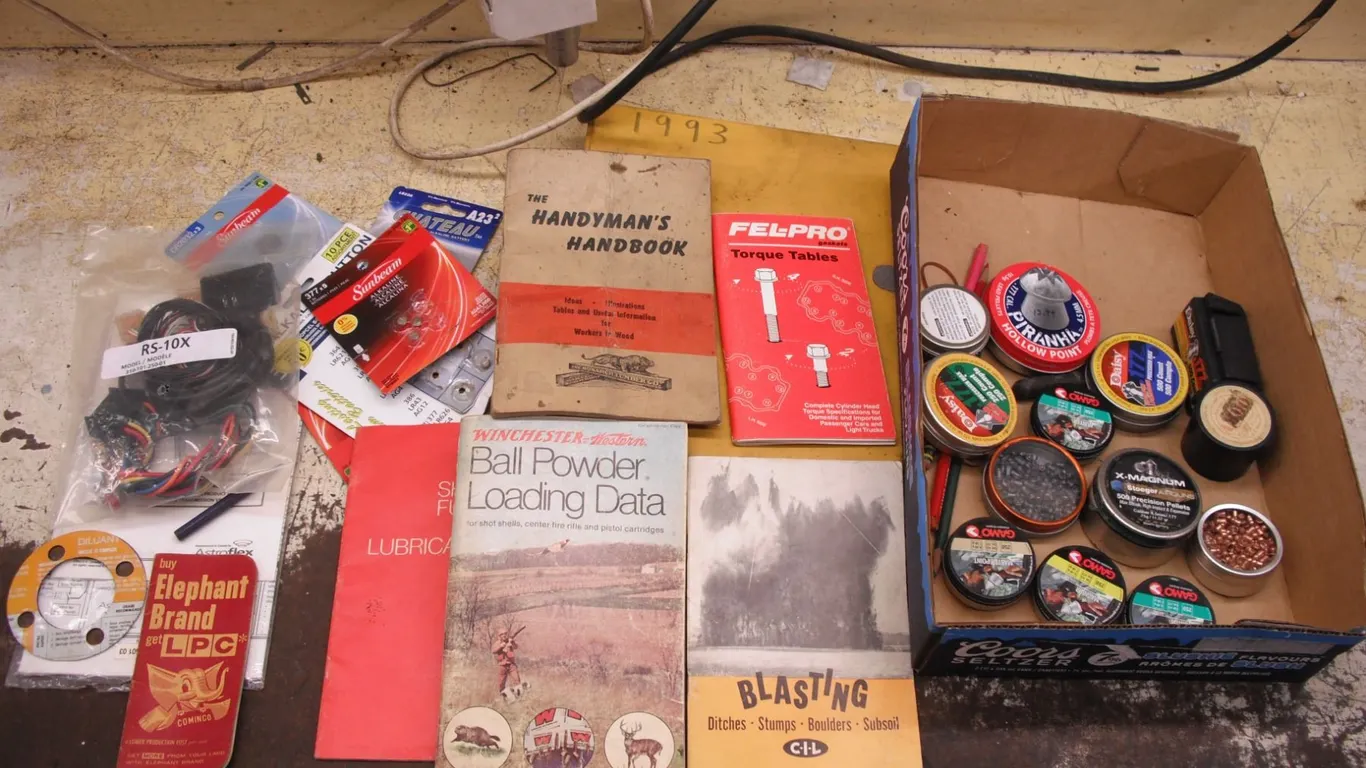 large lot of pellets, handyman and reloading books, etc.