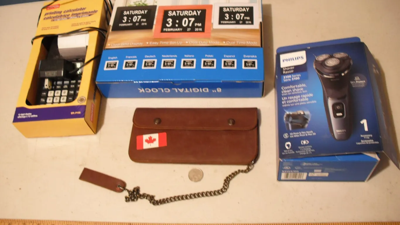 printing calculator, digital clock, and philips razor