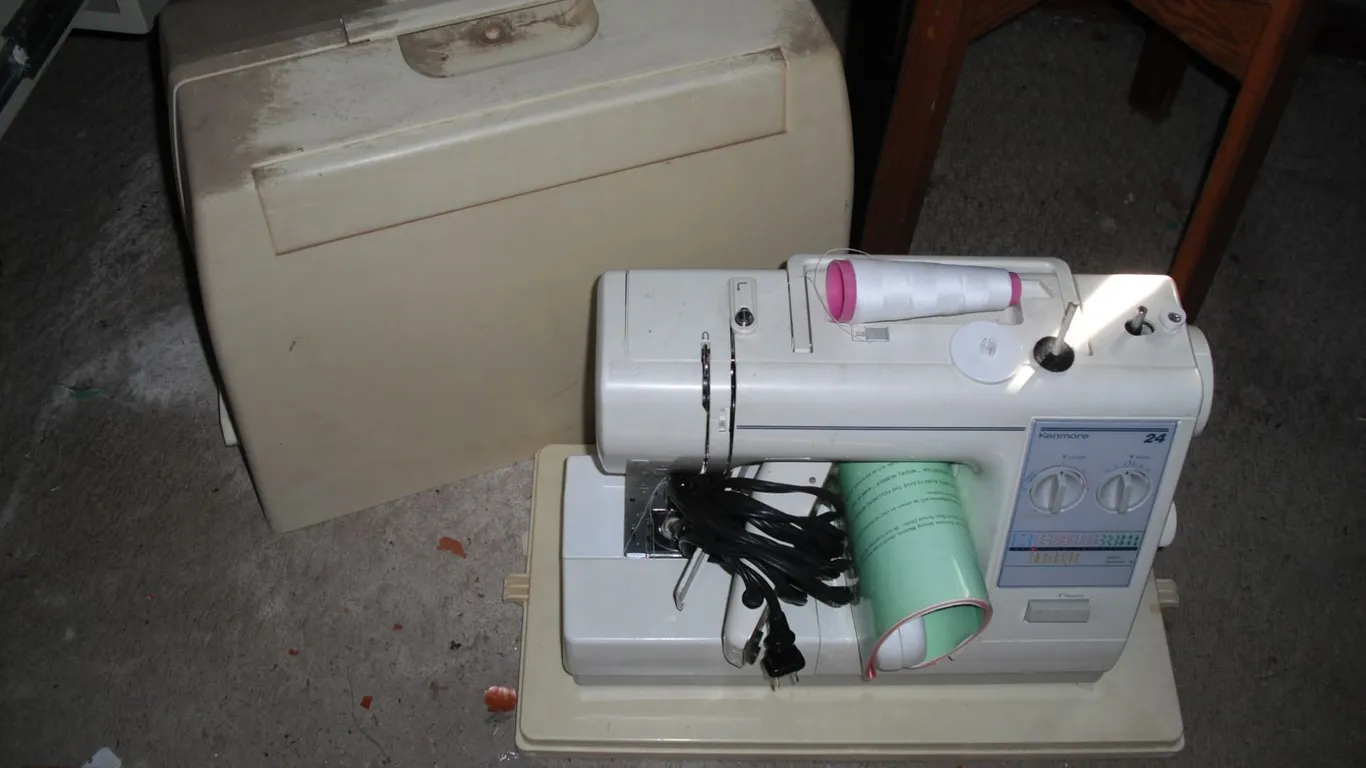 Kenmore sewing machine with pedal, manual and accessories